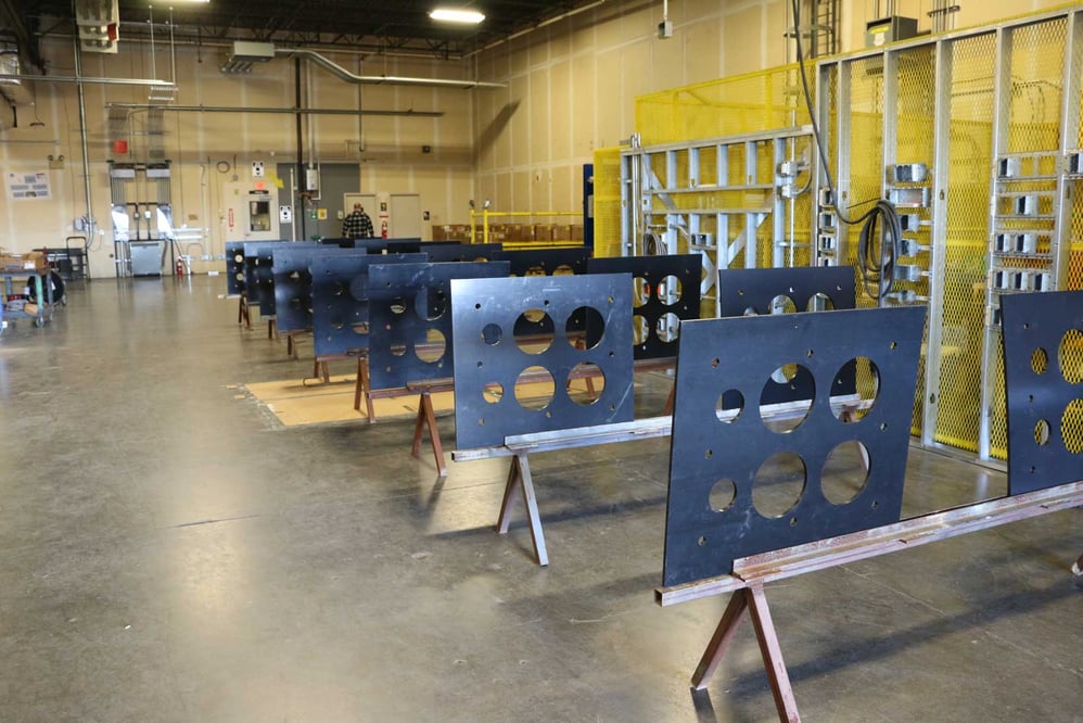 rows of Prefabricated metal sheets with cutouts
