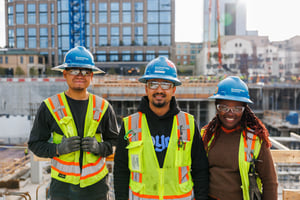 Group of Cummings technicians smiling with a downtown view in the background