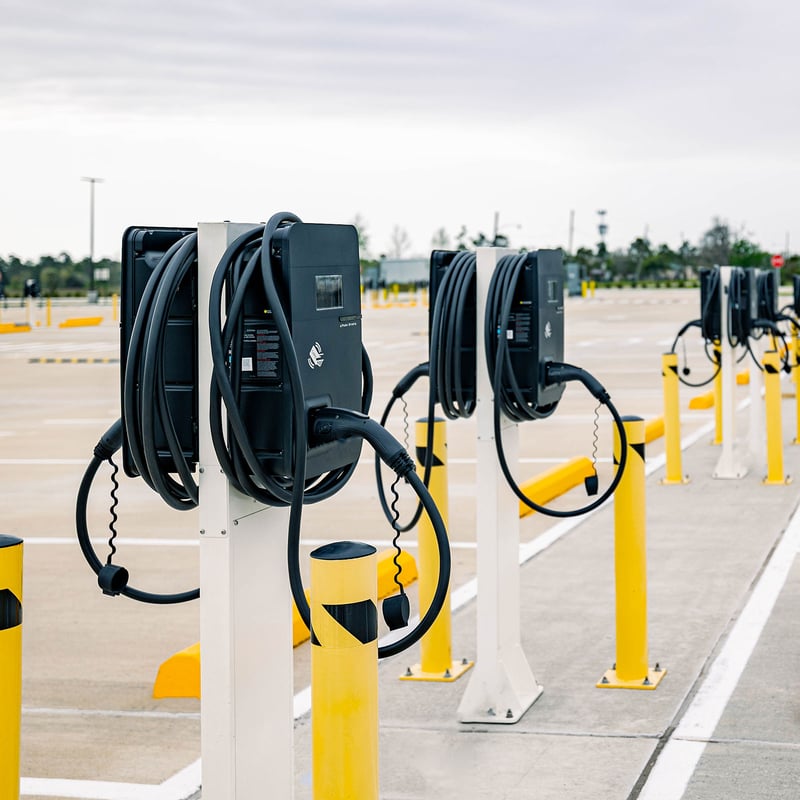 rows of EV chargers in a parking lot