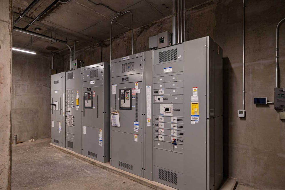 view of a few panels in a concrete-walled room