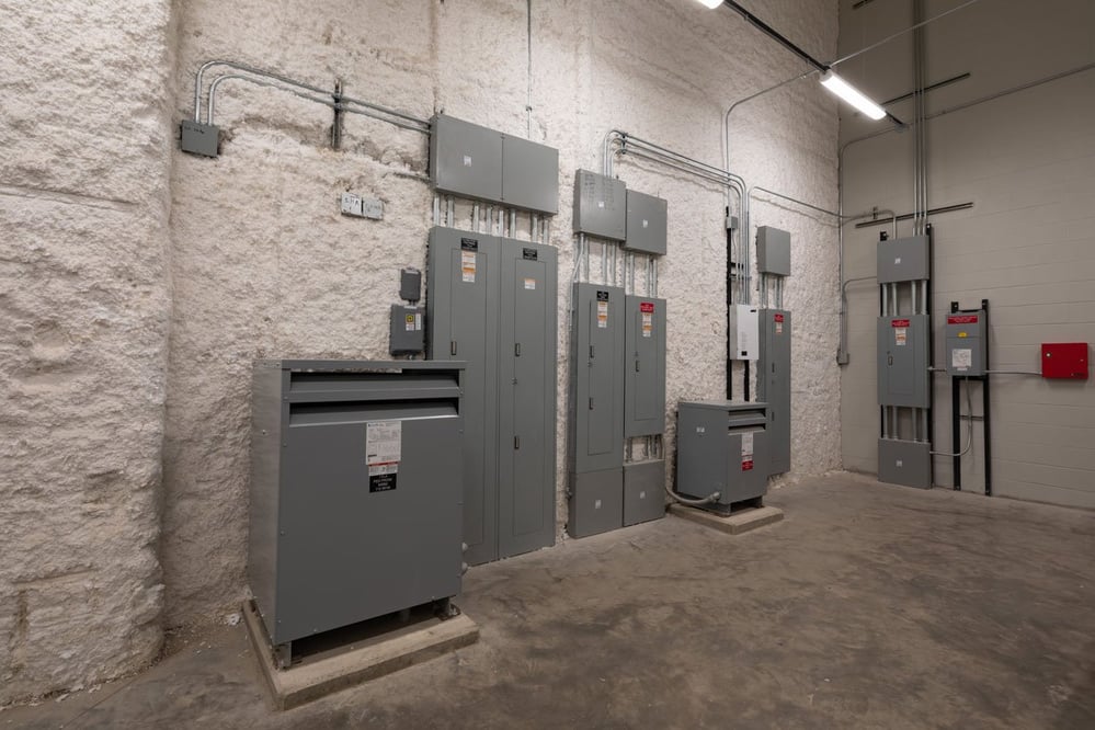 room with various electrical panels and equipment