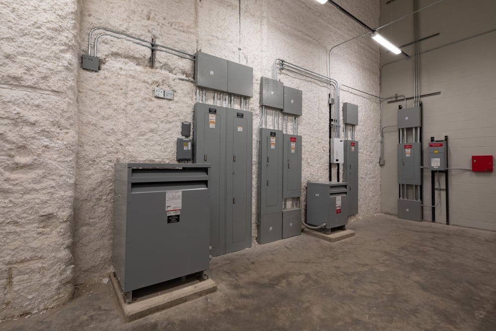 room with various electrical panels and equipment
