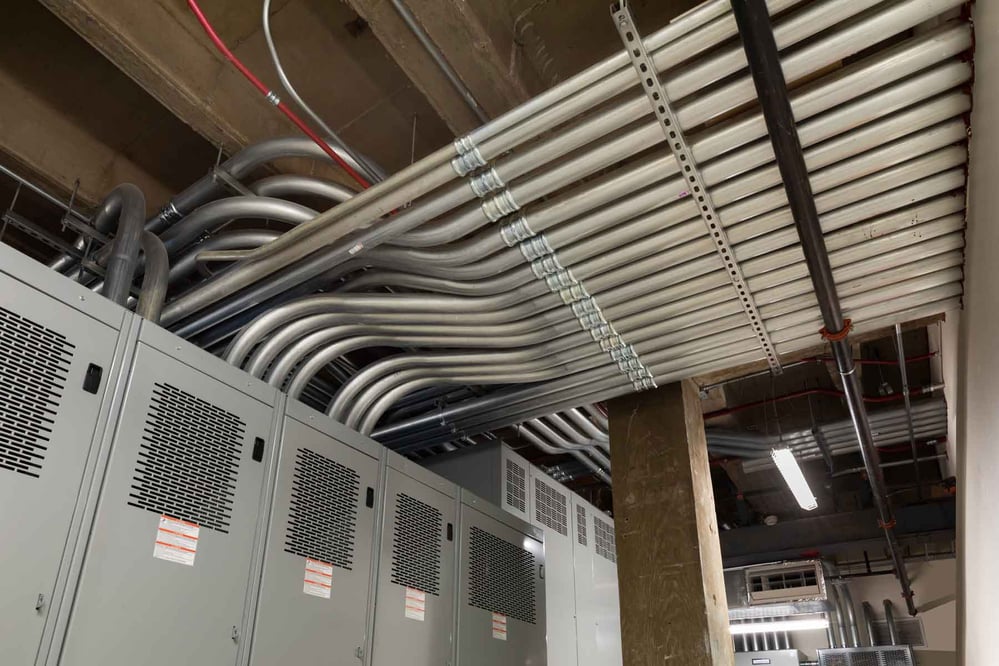 ceiling view of lines of conduit