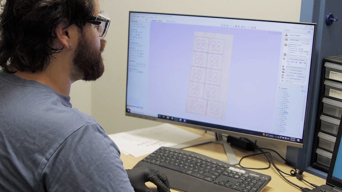 Cummings-Integrated-Manufacturing-worker-on-computer-using-CNC-router