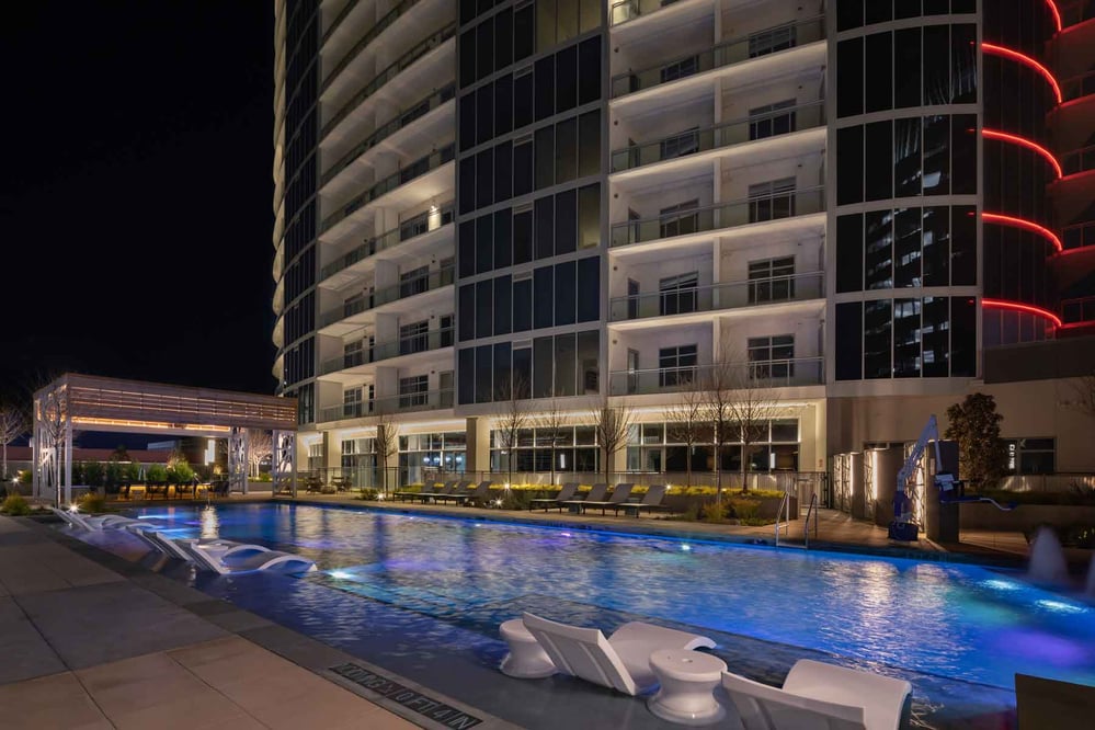 outdoor view of a modern hotel building next to a pool