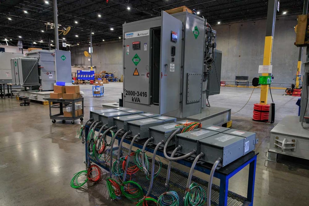 A prefabricated skid being worked on inside of a warehouse
