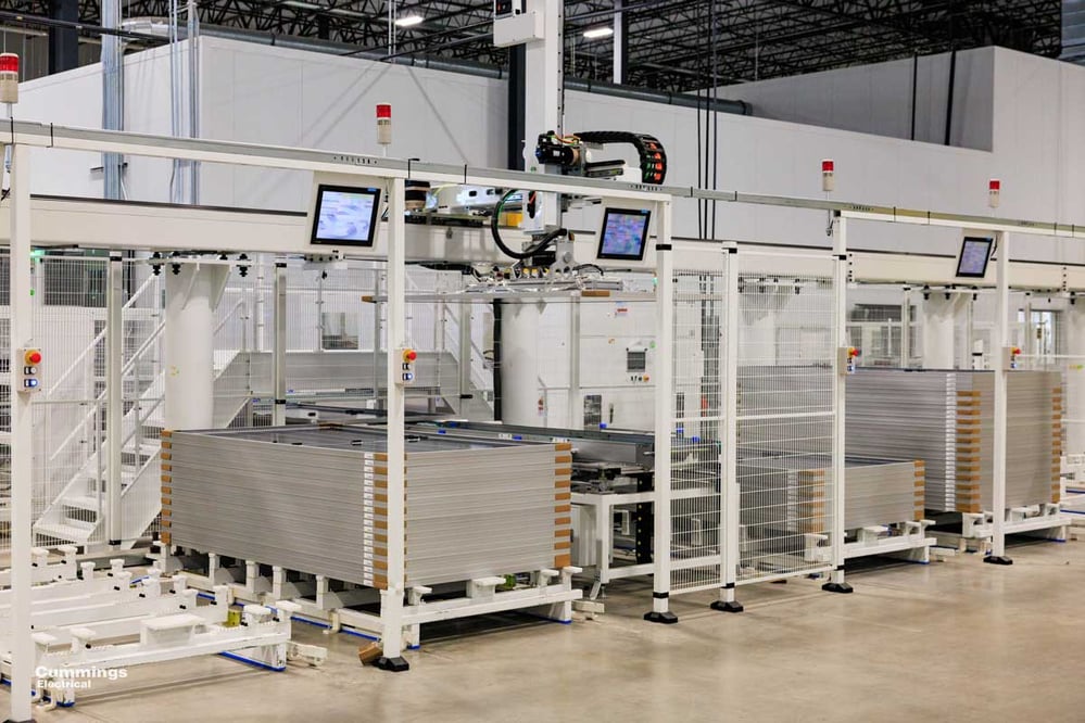 rows of high-tech screens and cages for manufacturing equipment