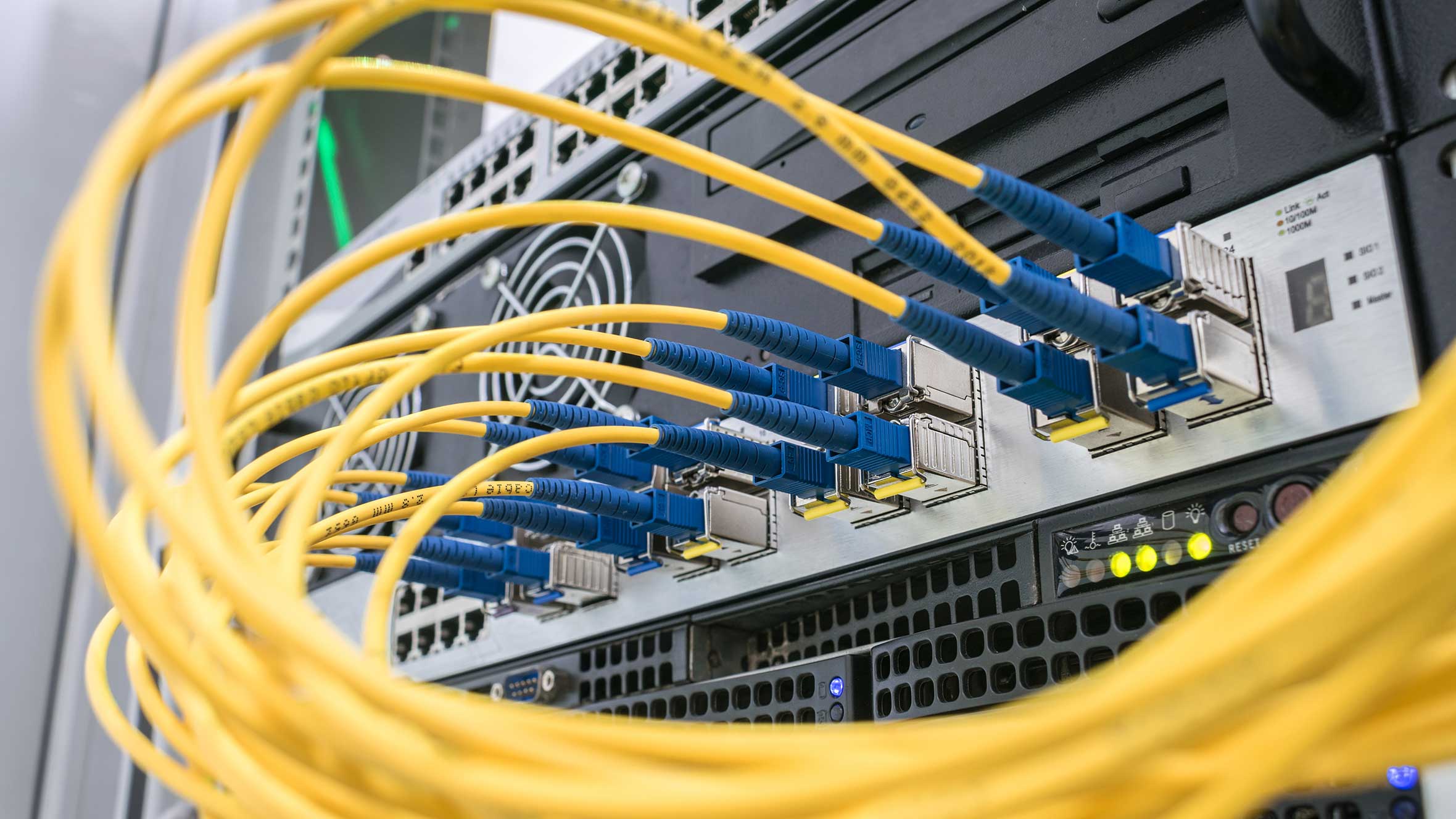 A bunch of fiber optic Internet wires are connected to the router modules
