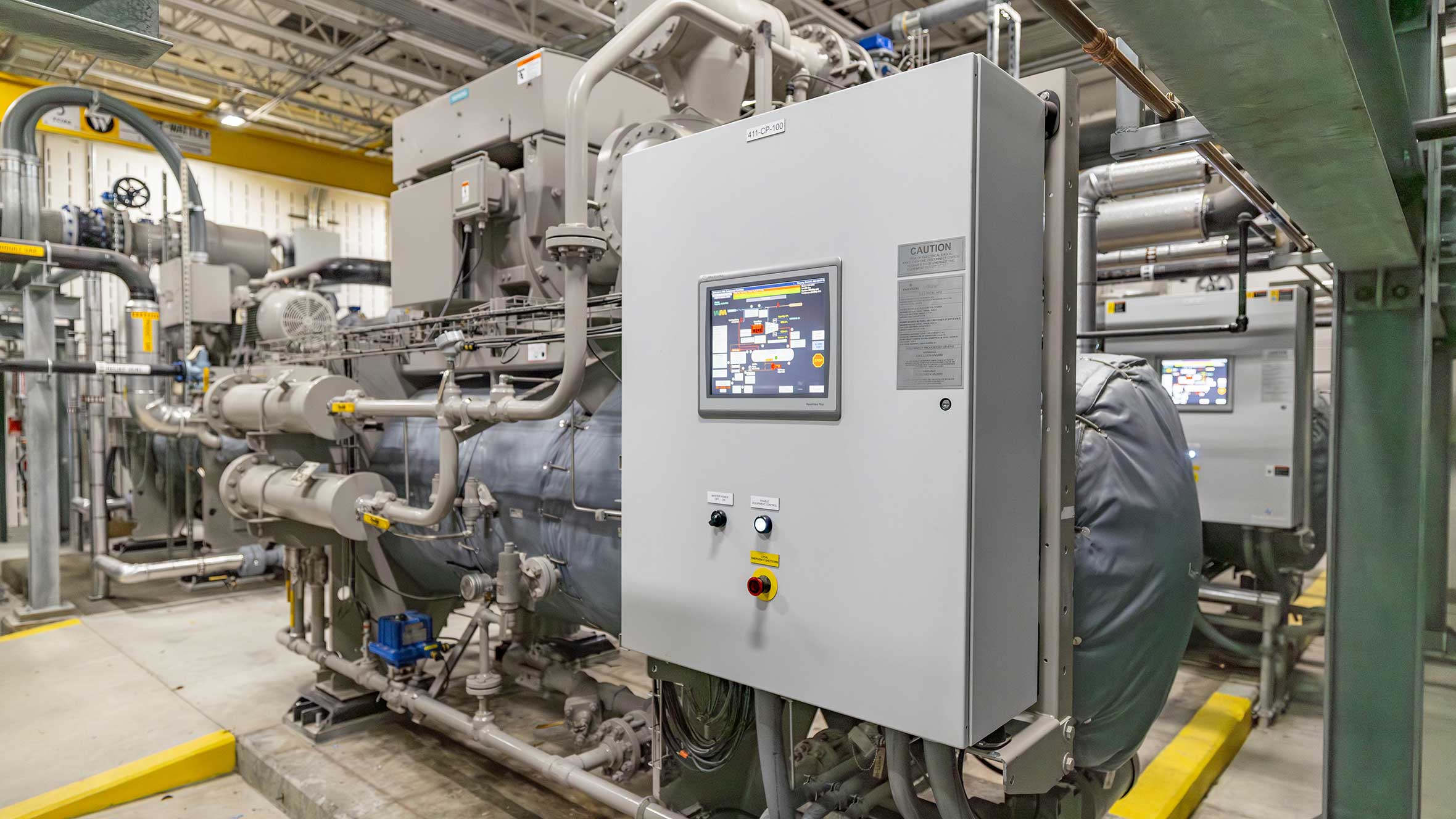 A large industrial machine featuring a digital monitor, showcasing its advanced technology and operational capabilities