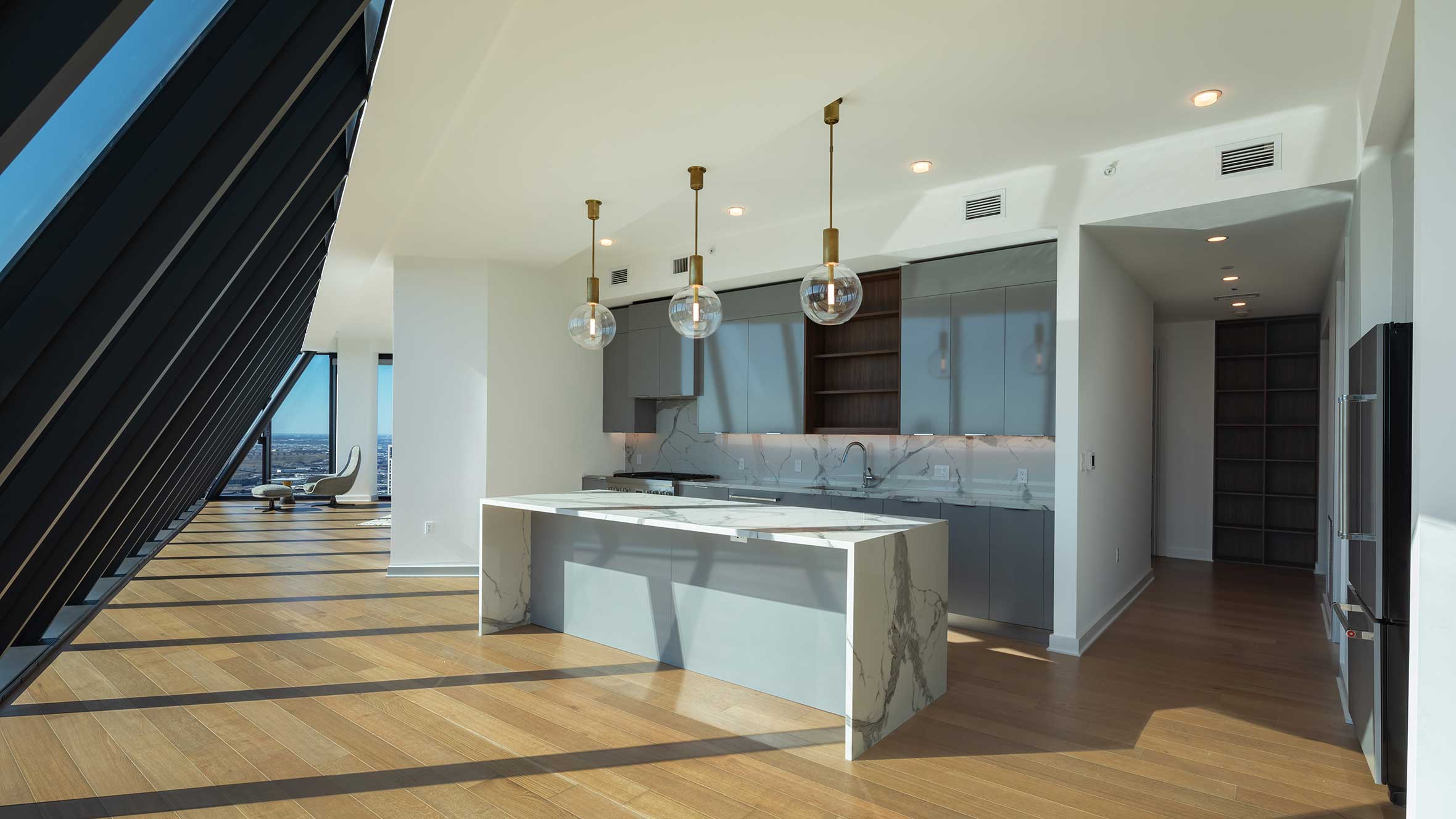 Bright kitchen with sleek appliances and a stunning view of the city