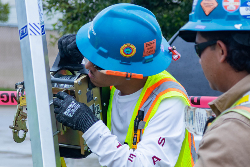 electricians wearing hard hats in a training session
