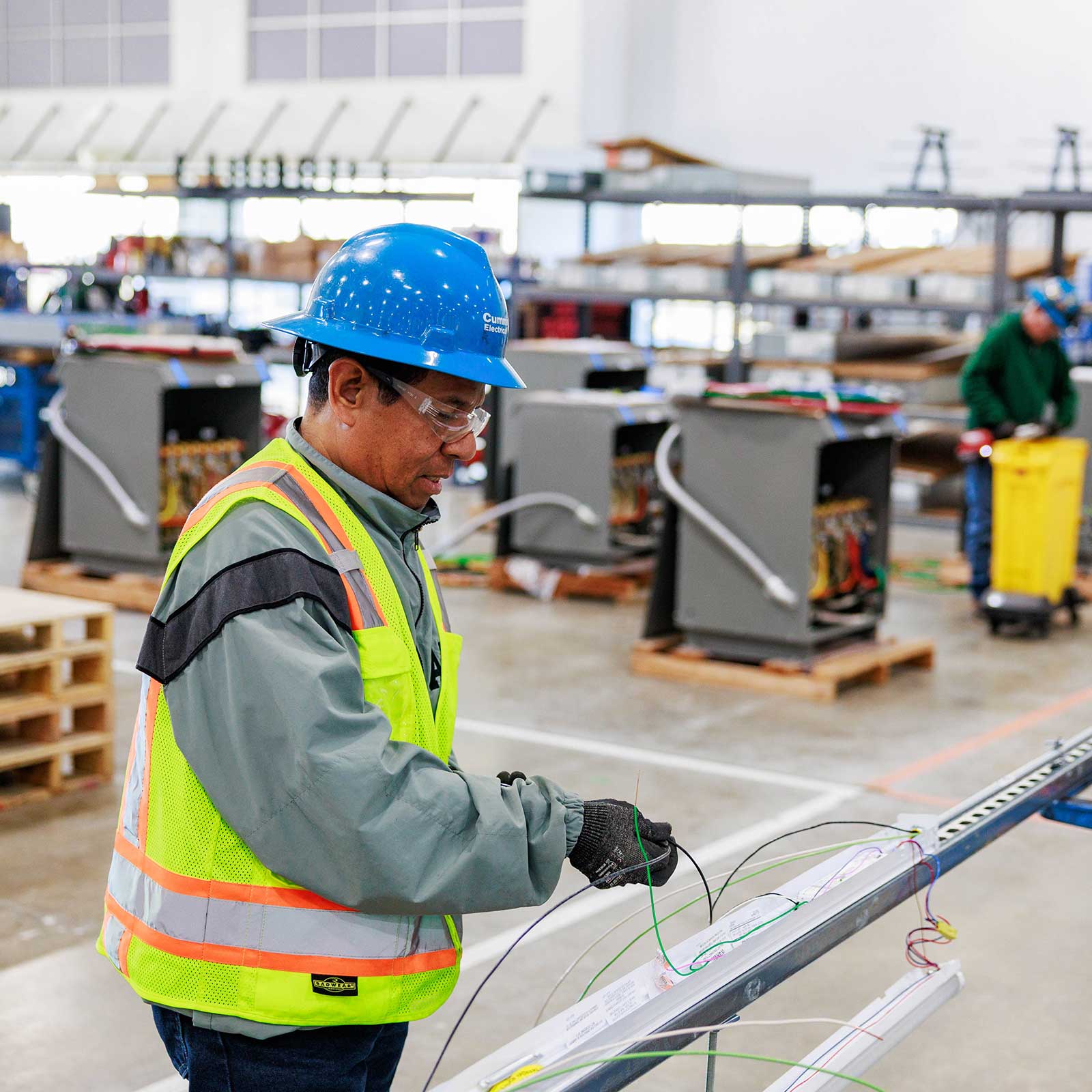 Electrician working in a facility producing prefabricated electrical equipment