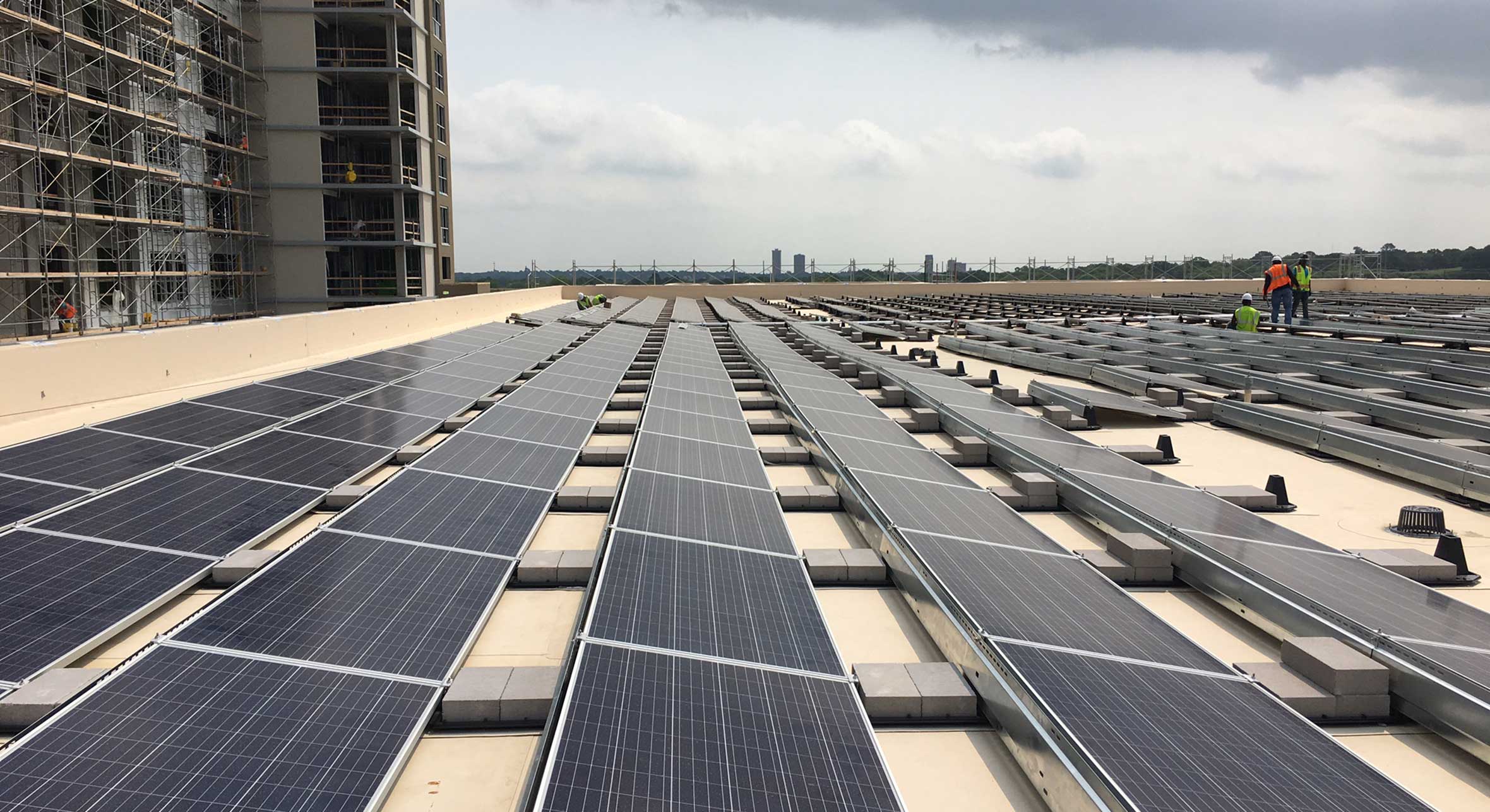 Electricians on a solar panel field