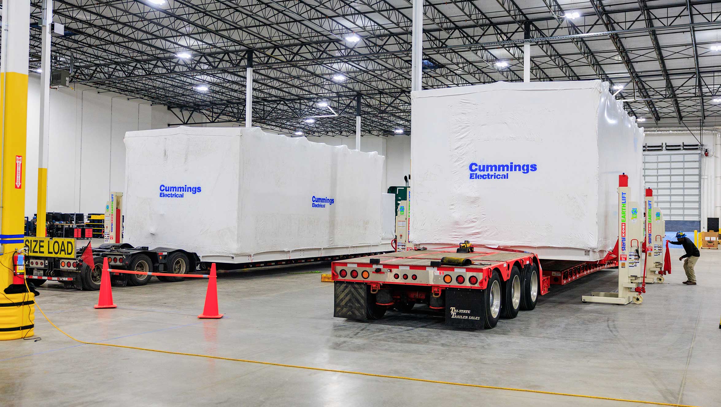 Loading an e-house in a truck inside a warehouse