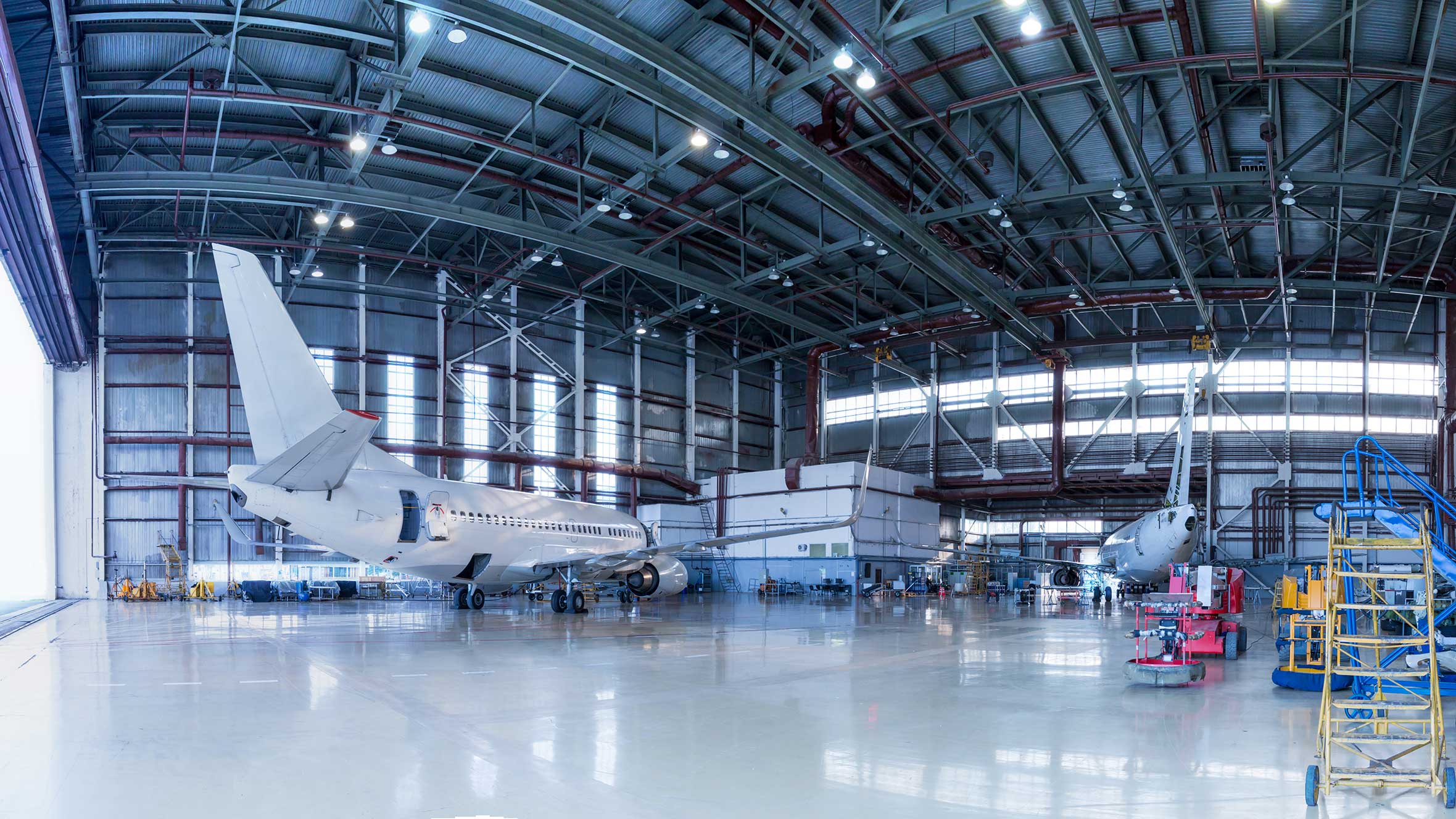 Panorama of airplanes in the hangar