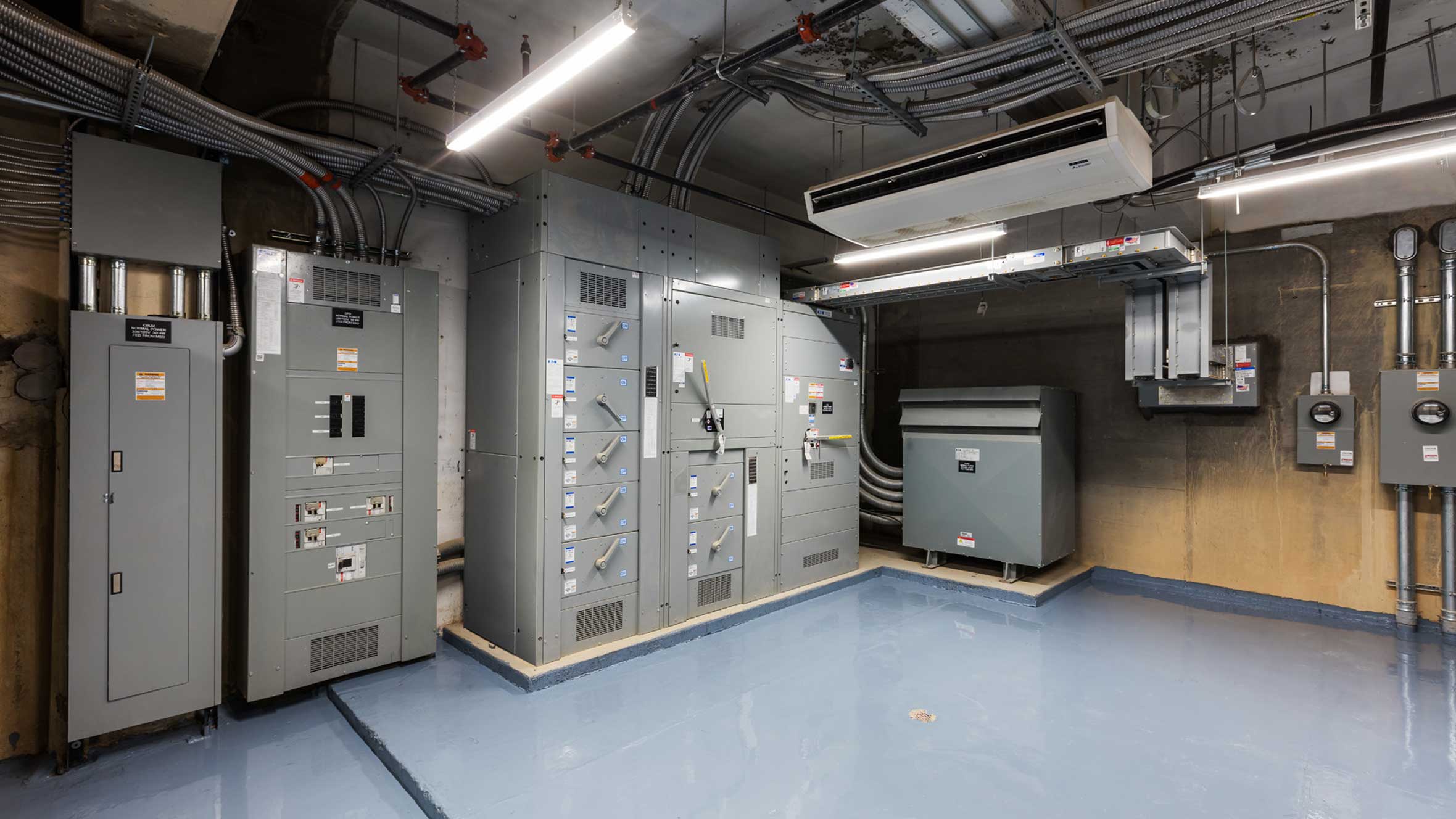 indoor electrical room with various panels and meters