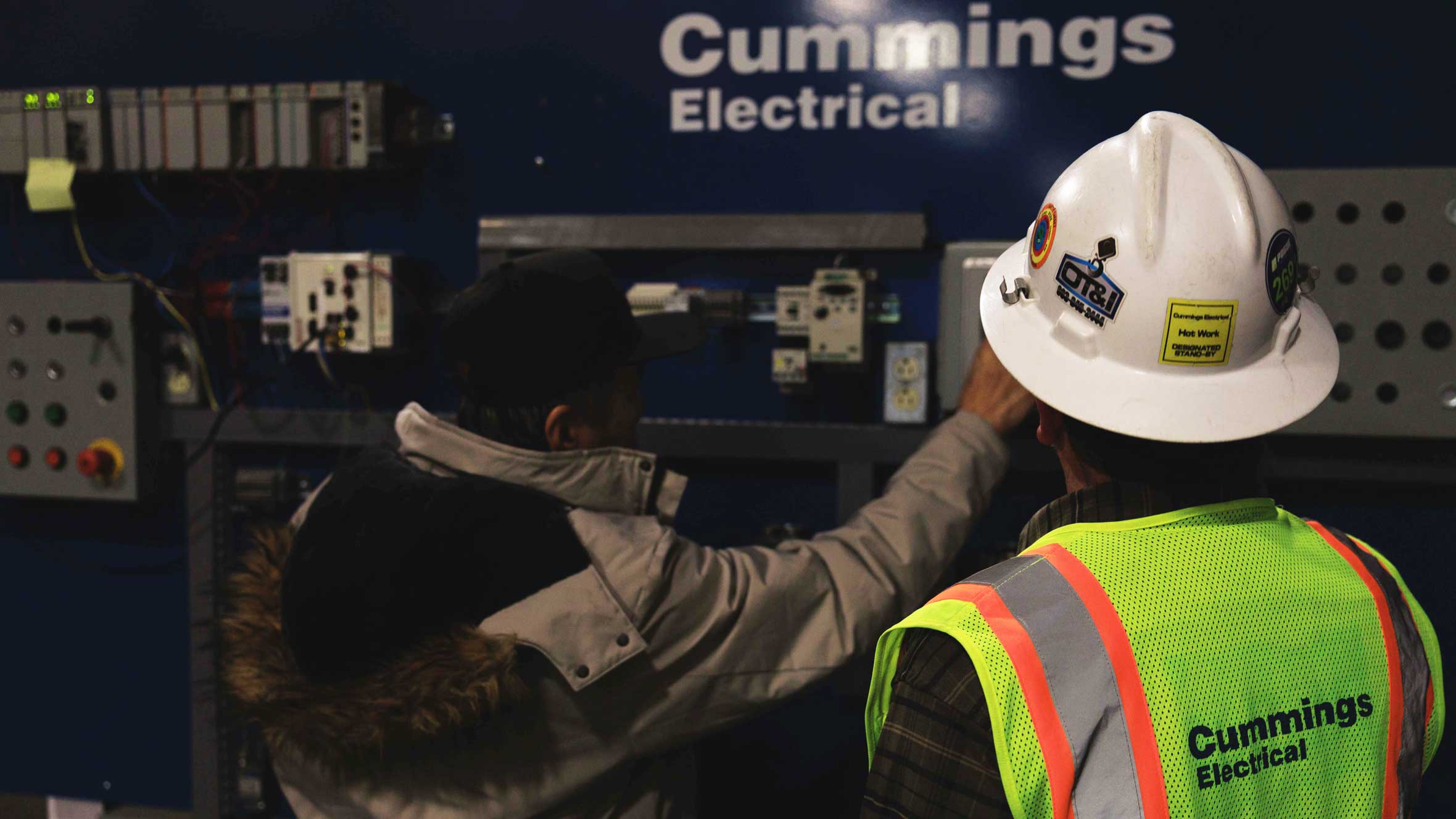 Cummings worker wearing safety equipment getting a controls and automations demonstration