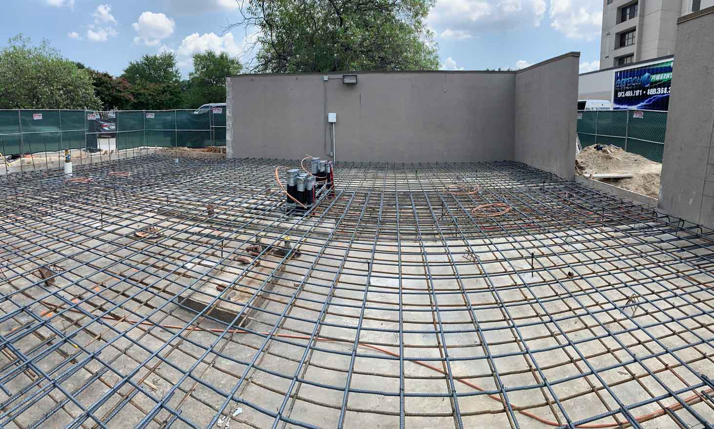Concrete slab preparation with rebar grid for electrical generator installation