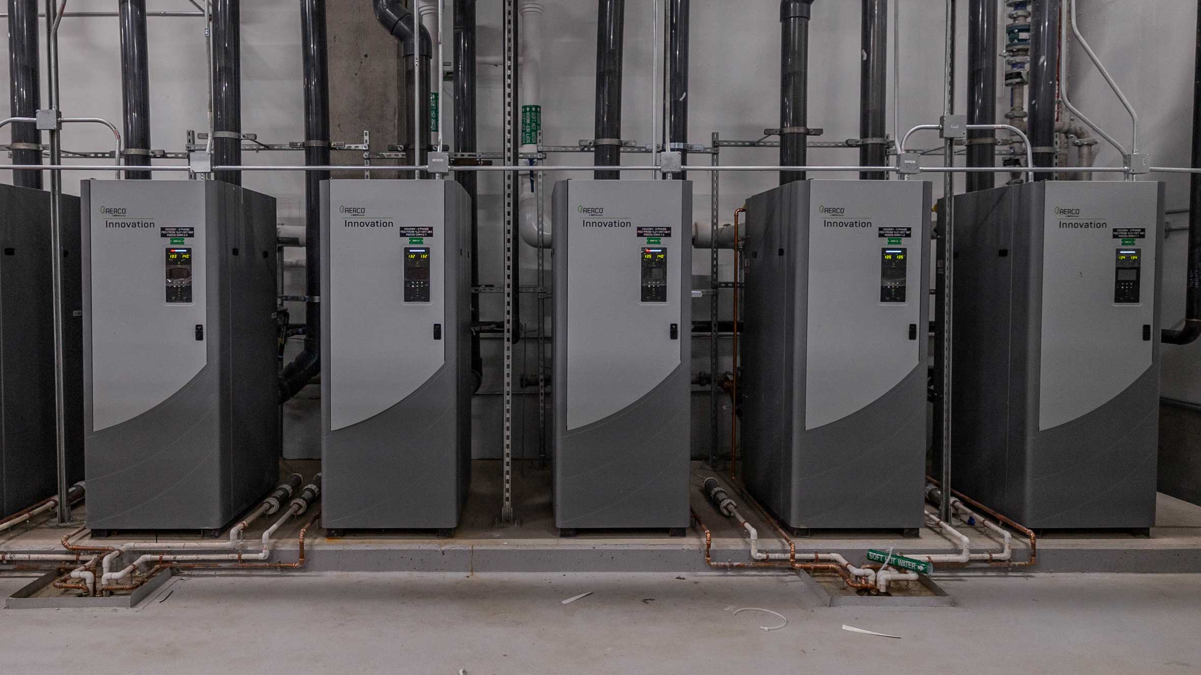 Row of AERCO energy efficient water heaters