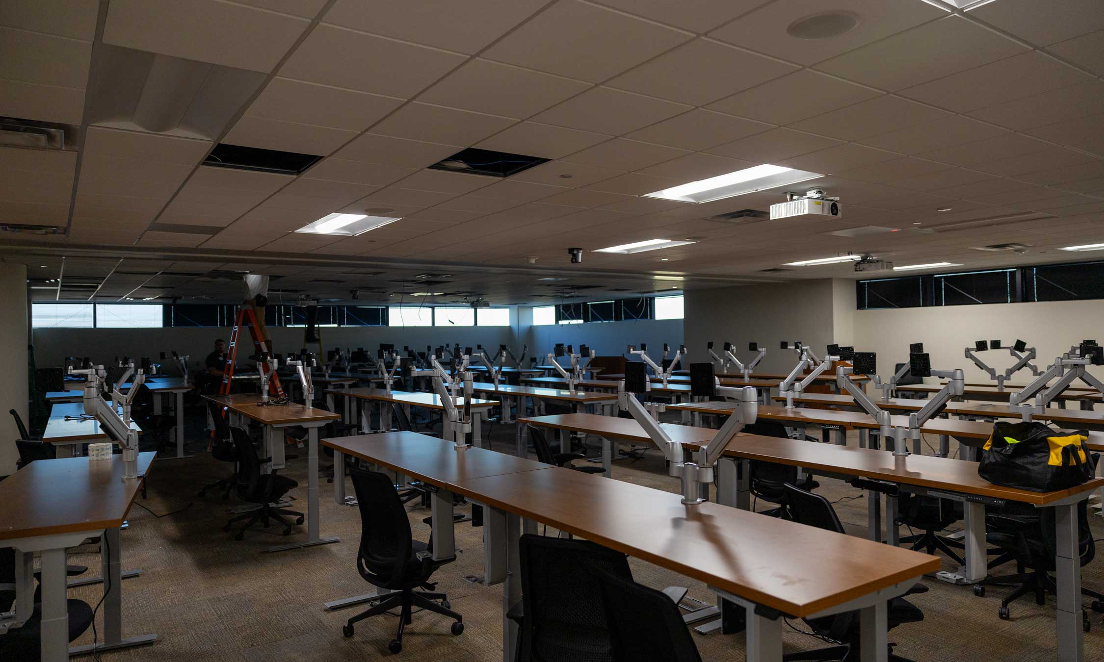 Southwest HQ room setup with rows of desks and monitor mounting systems