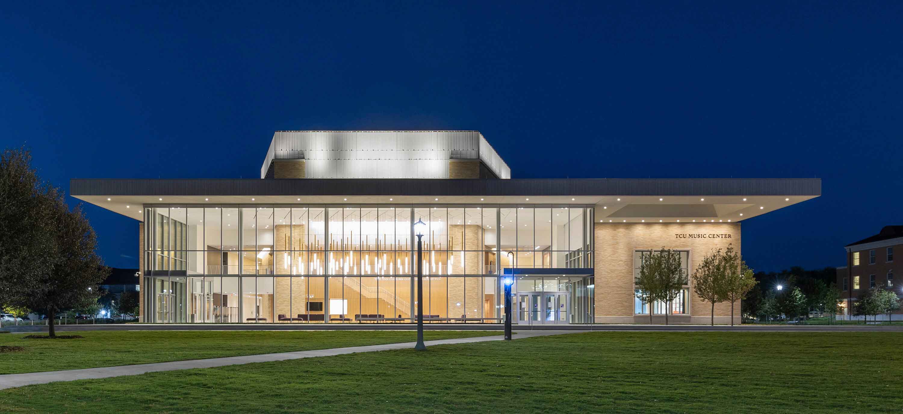 Exterior view of a modern TCU building with large glass panels covering the building