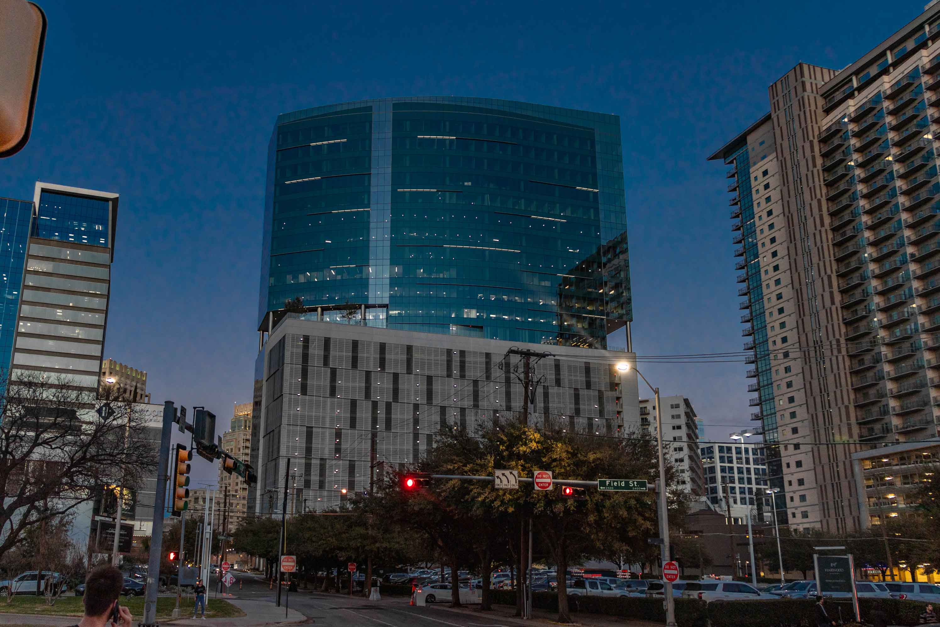 upward view of a contemporary high-rise building in the middle of a downtown street