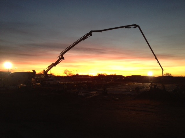 sunset view of a construction site with a crane 