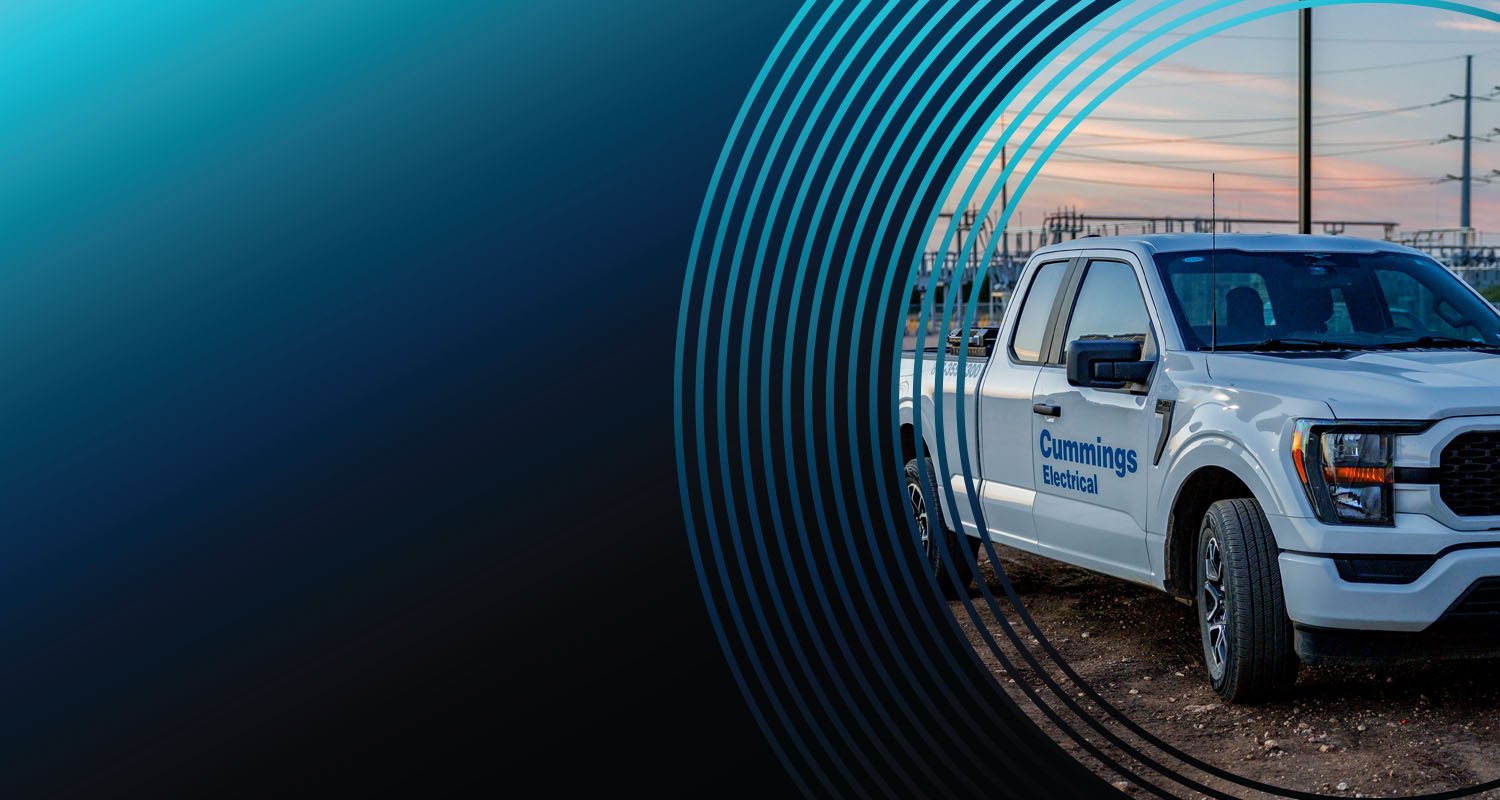 Cummings Electrical truck parked with a substation in the background